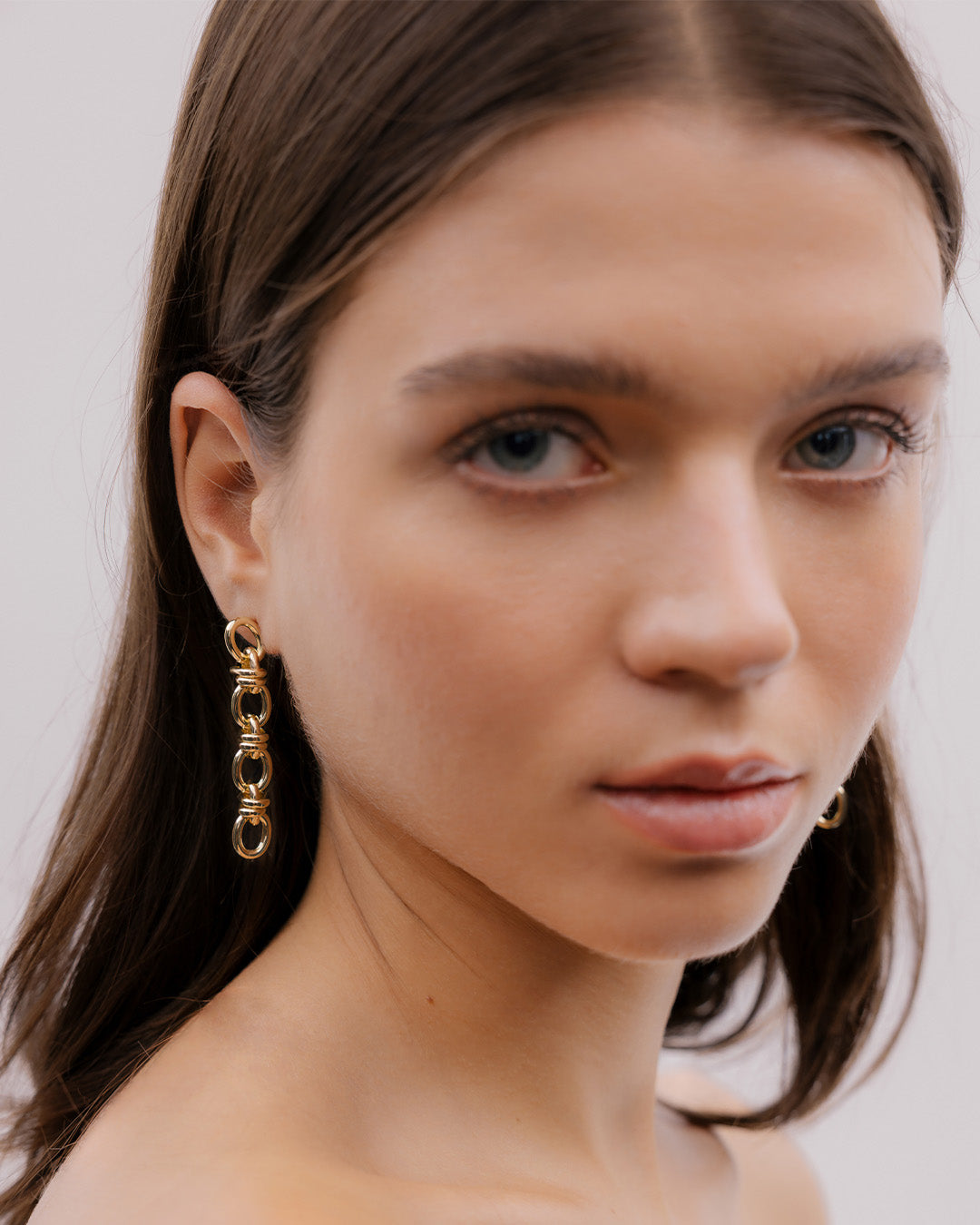 Aretes Eslabones Cruzados